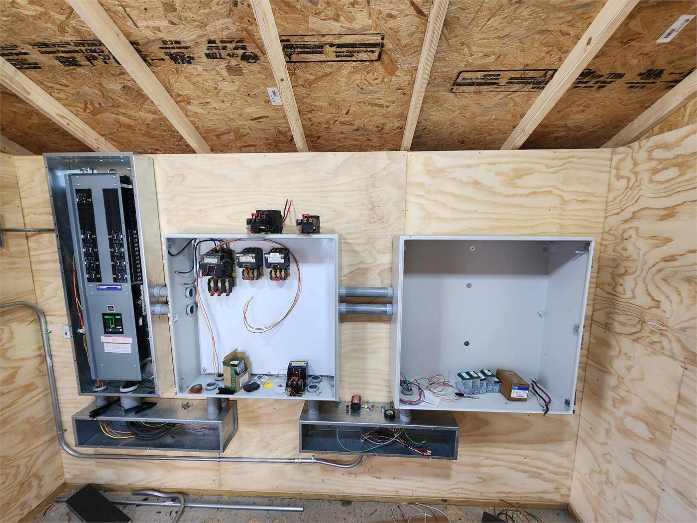 Electrical distribution and motor controls installed in a grain-system service building